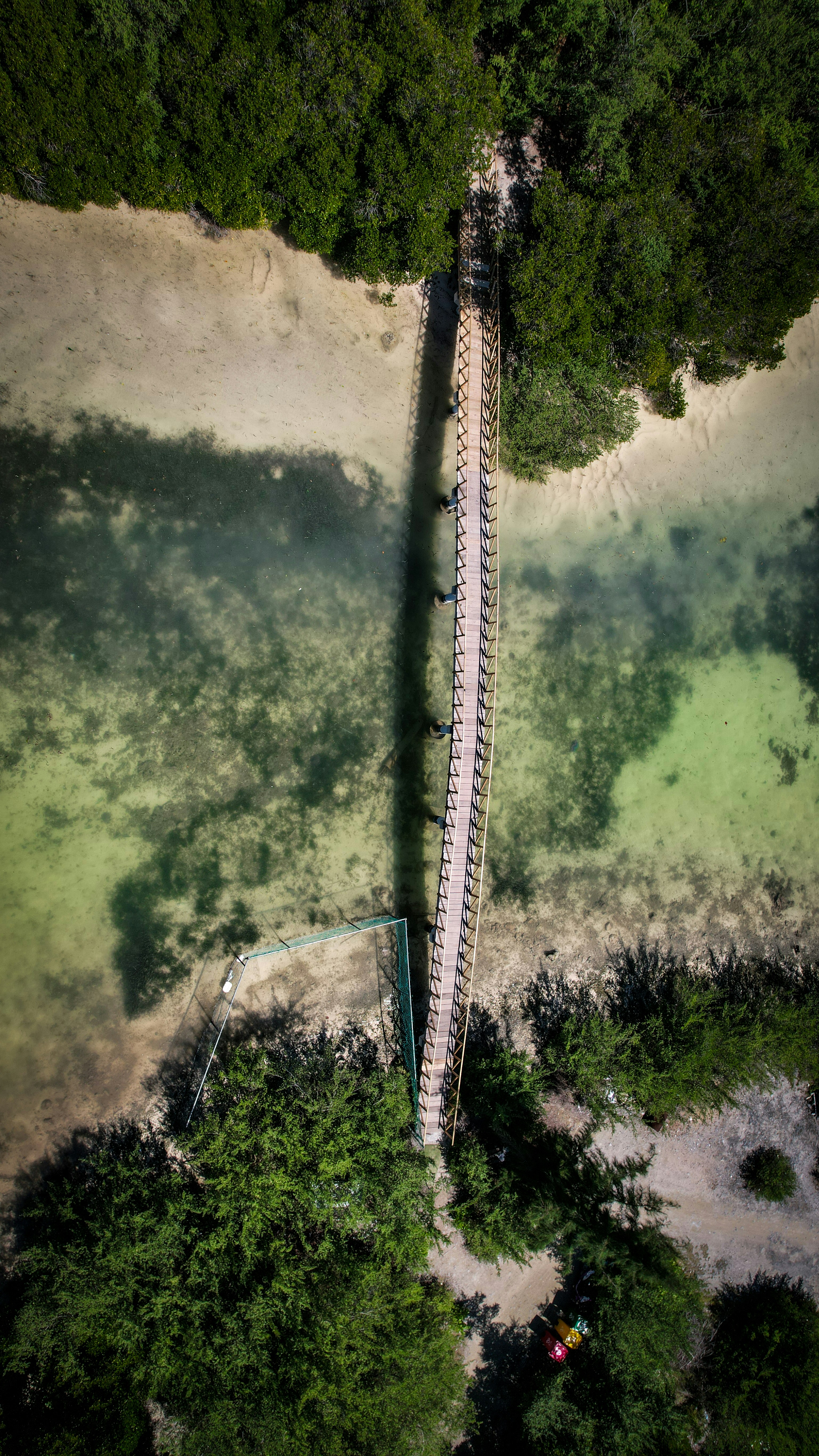An aerial view of a long bridge over a river photo – Free Maldives ...
