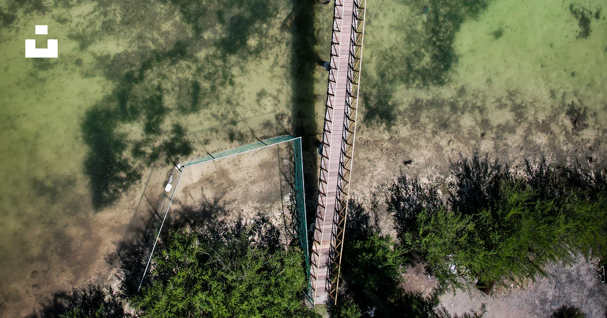 An aerial view of a long bridge over a river photo – Free Maldives ...