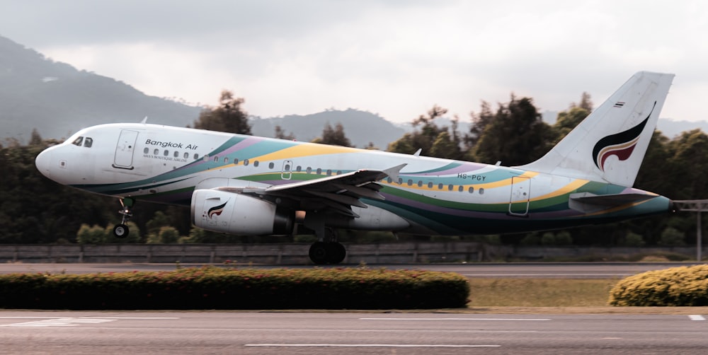 a large passenger jet taking off from an airport runway