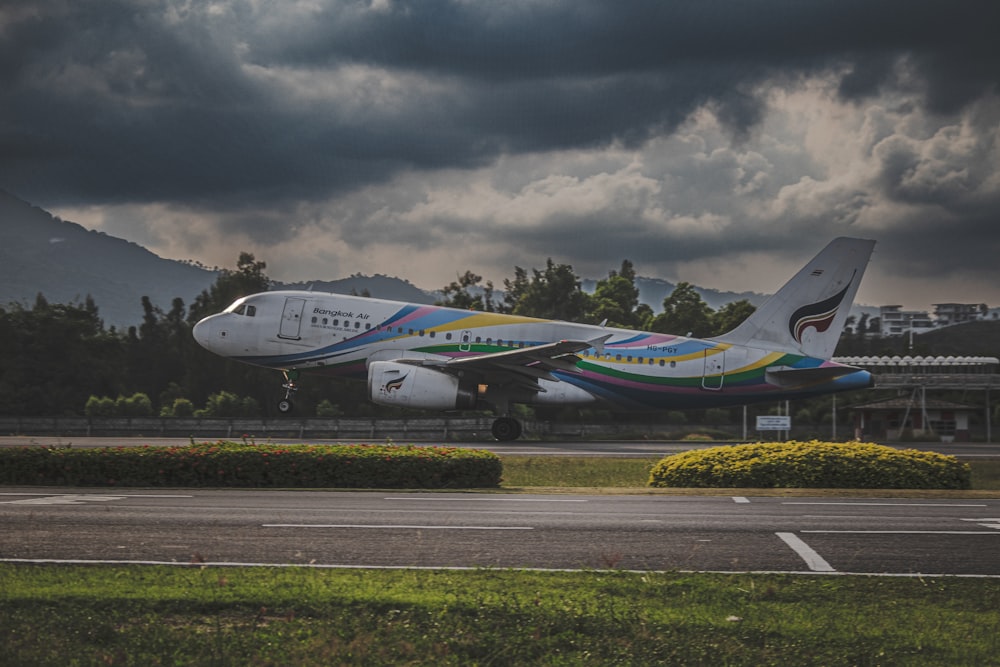 a large jetliner sitting on top of an airport runway