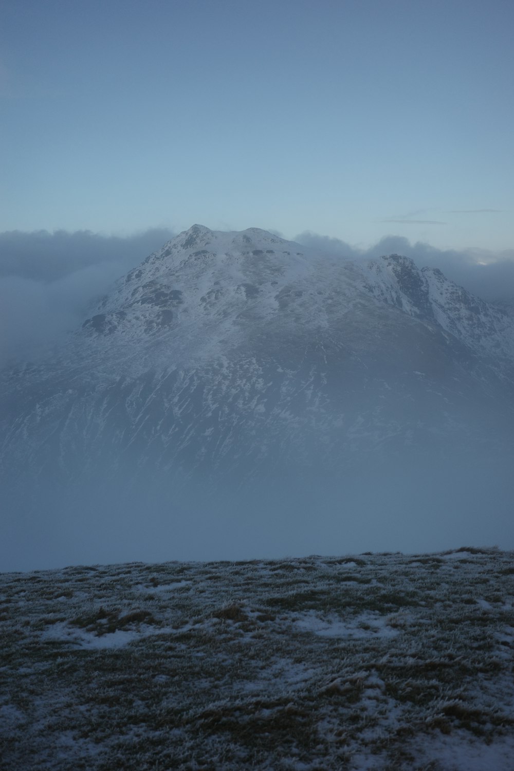 a snow covered mountain in the distance