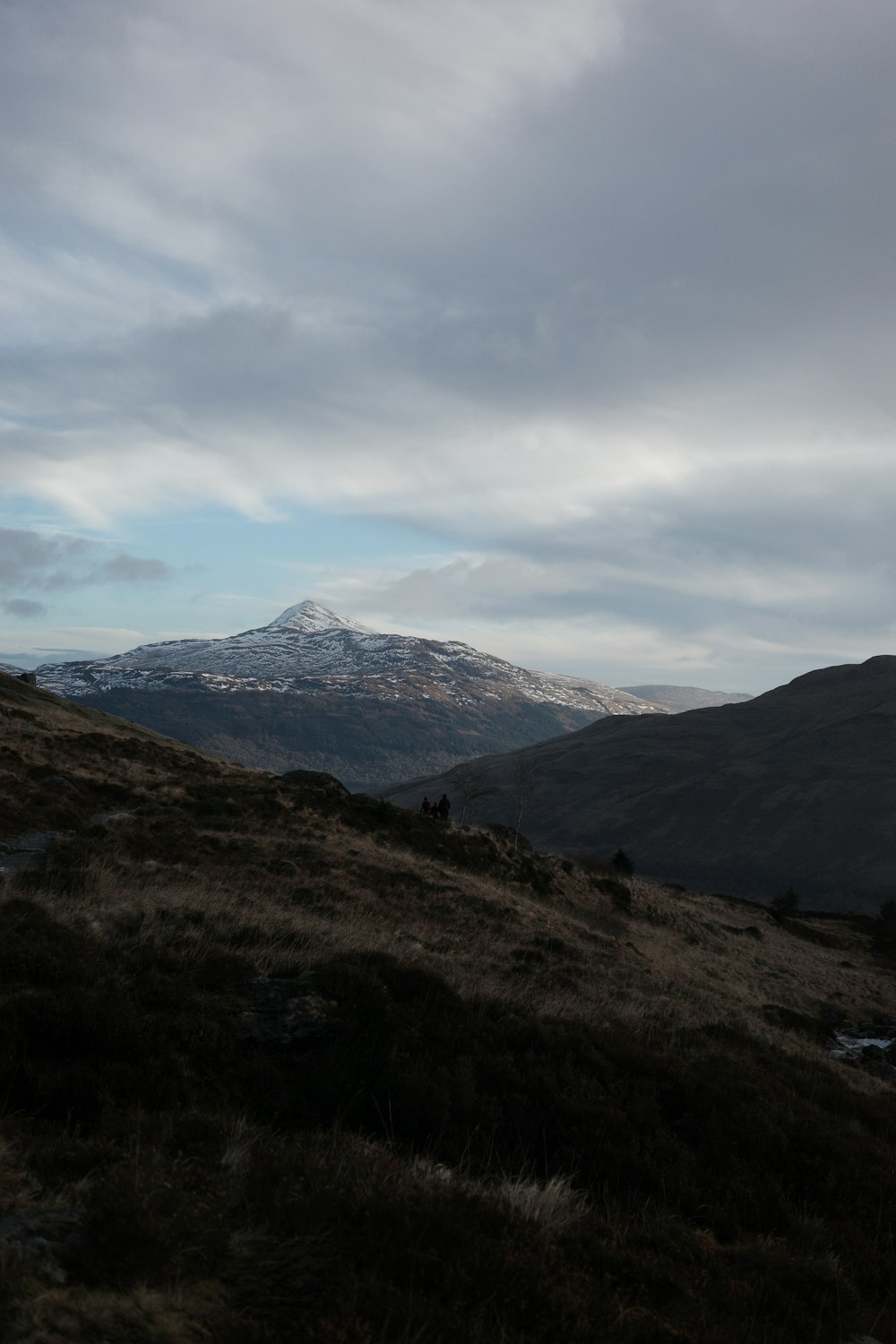 a view of a mountain range with snow on the top