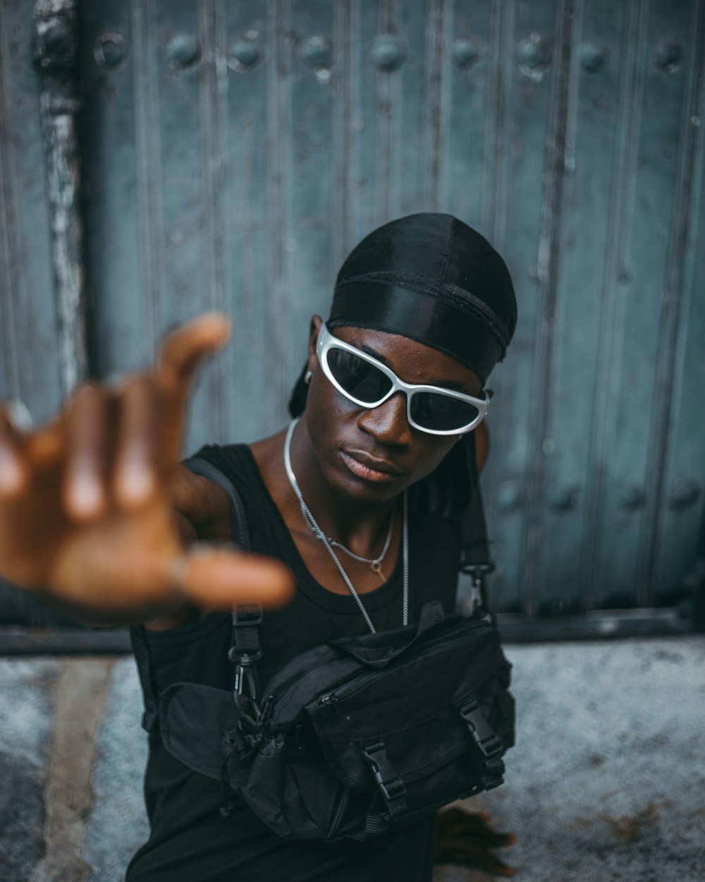 a woman wearing sunglasses and a black shirt