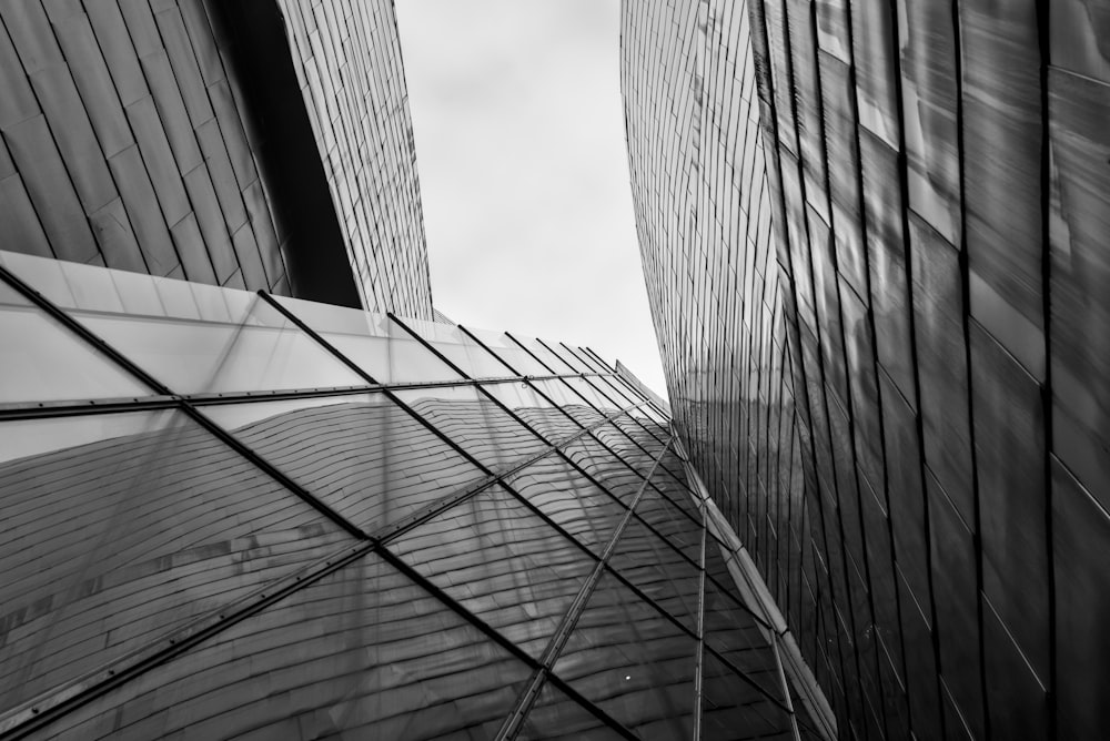 a black and white photo of two tall buildings