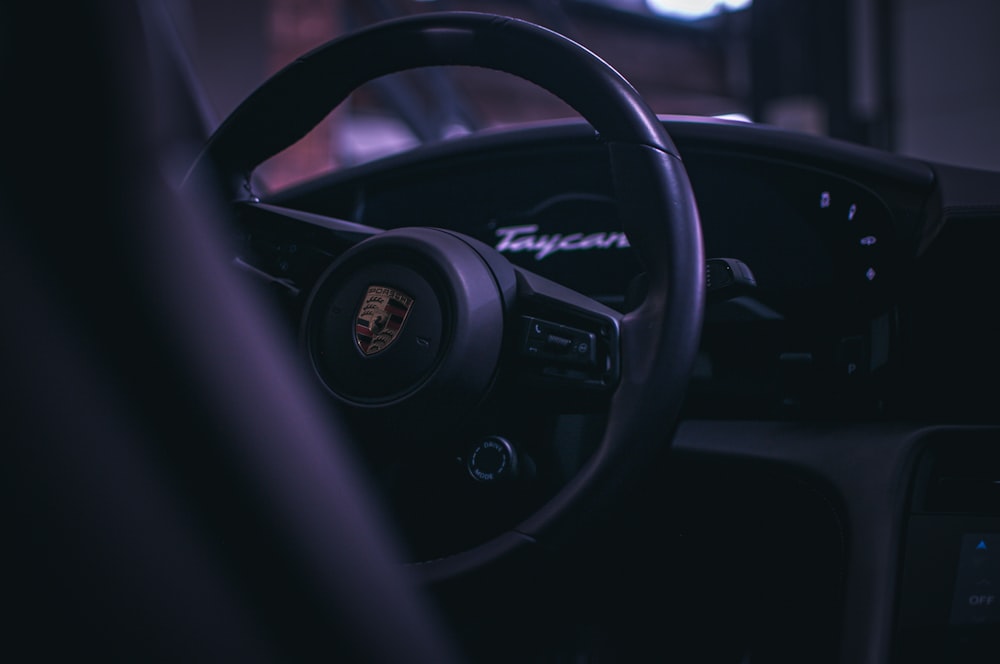 a steering wheel and dashboard of a car