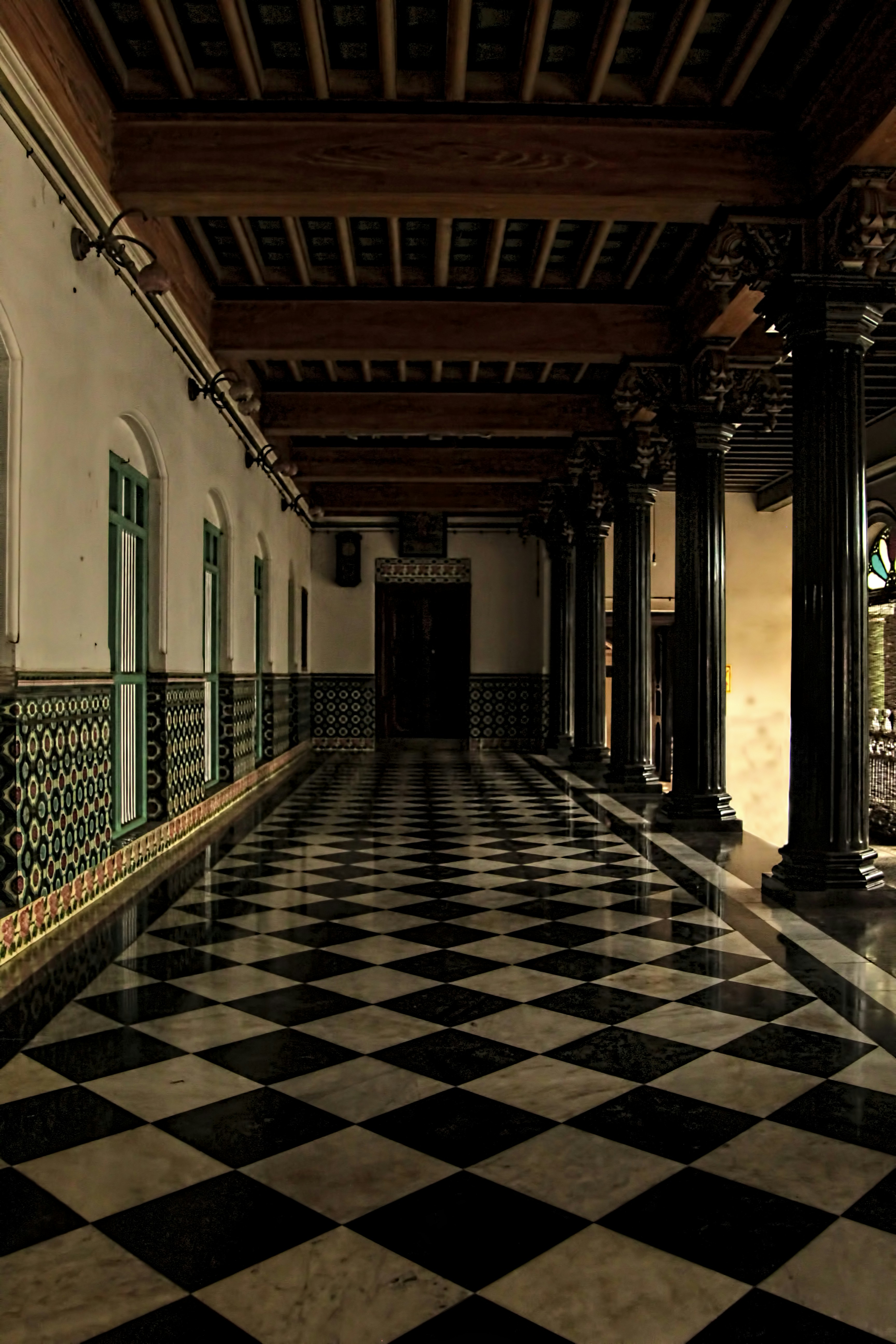 a black and white checkered floor in a building