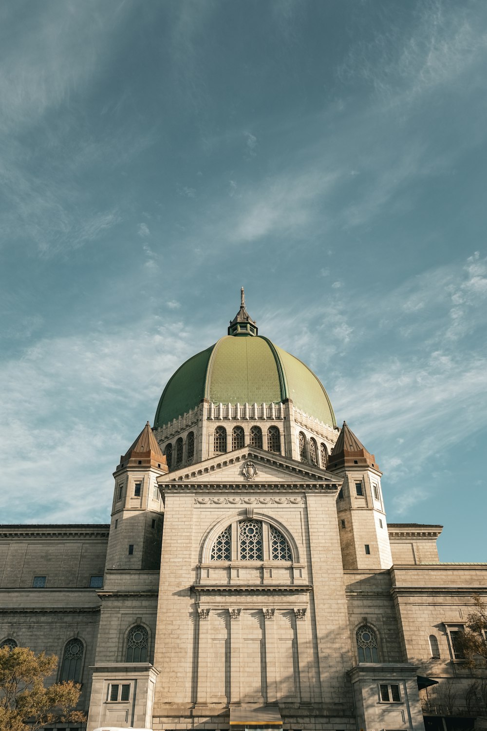a large building with a green dome on top