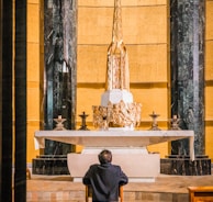 a man sitting in a chair in a church