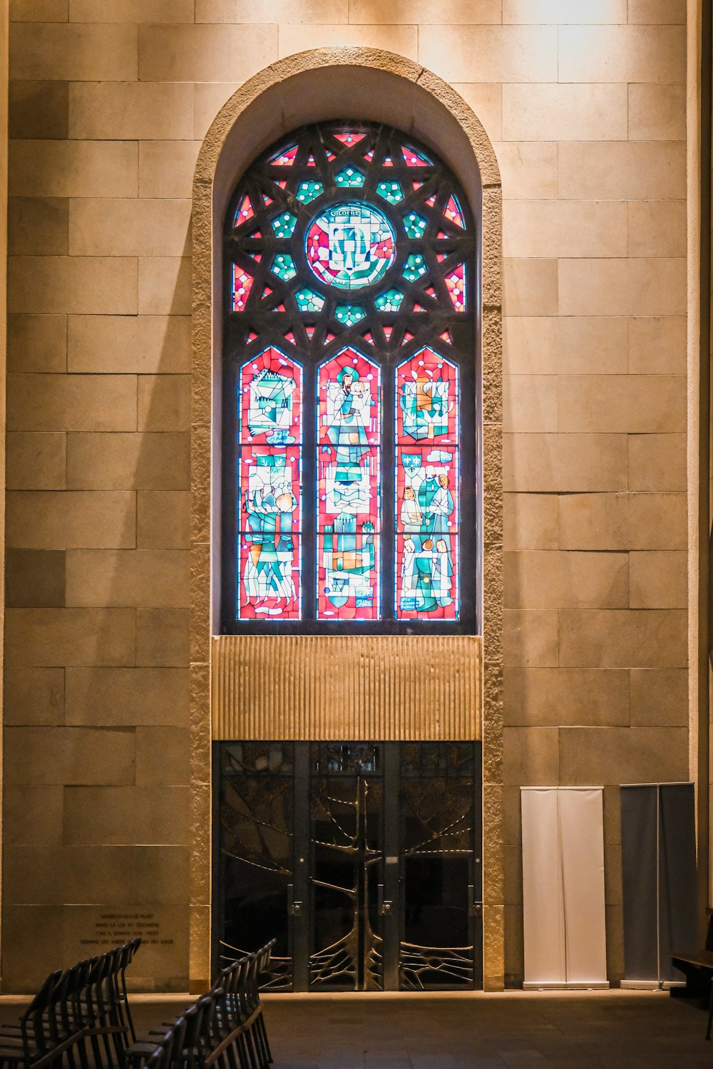 a large stained glass window in a church