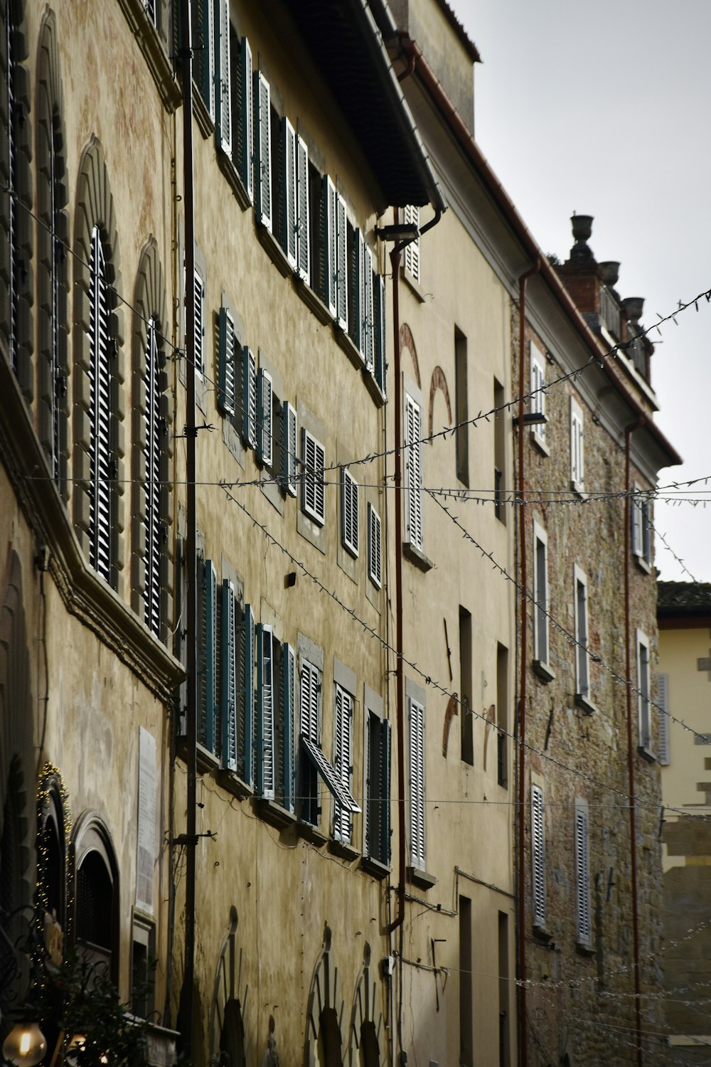 an old building with many windows and shutters