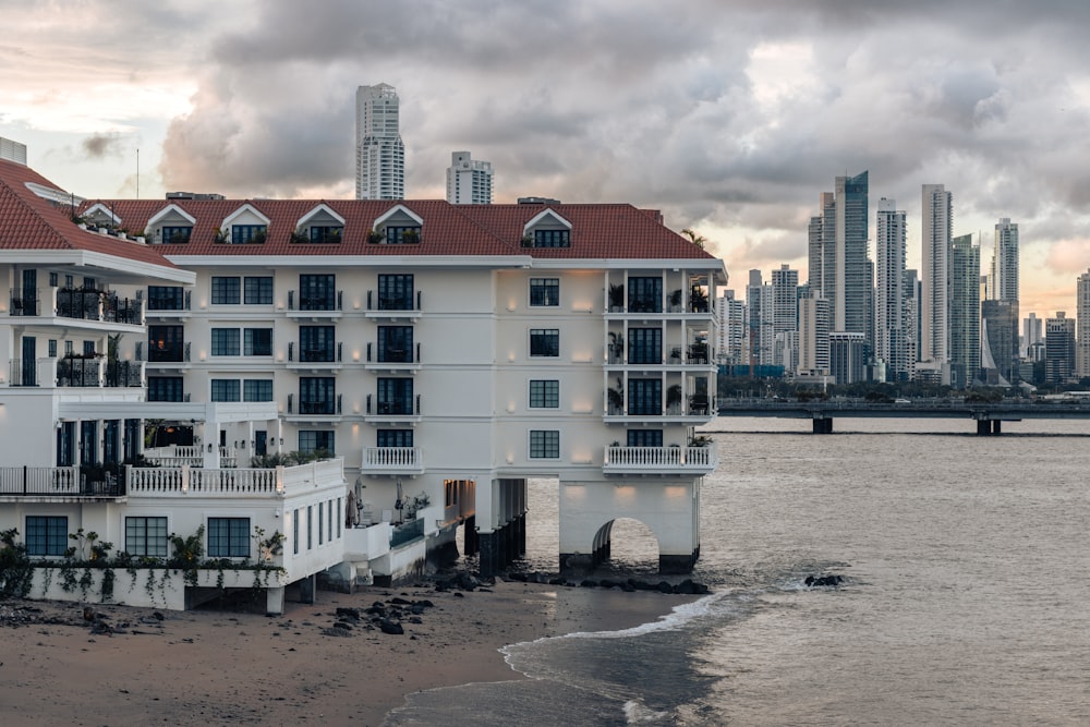 a large white building sitting on top of a beach