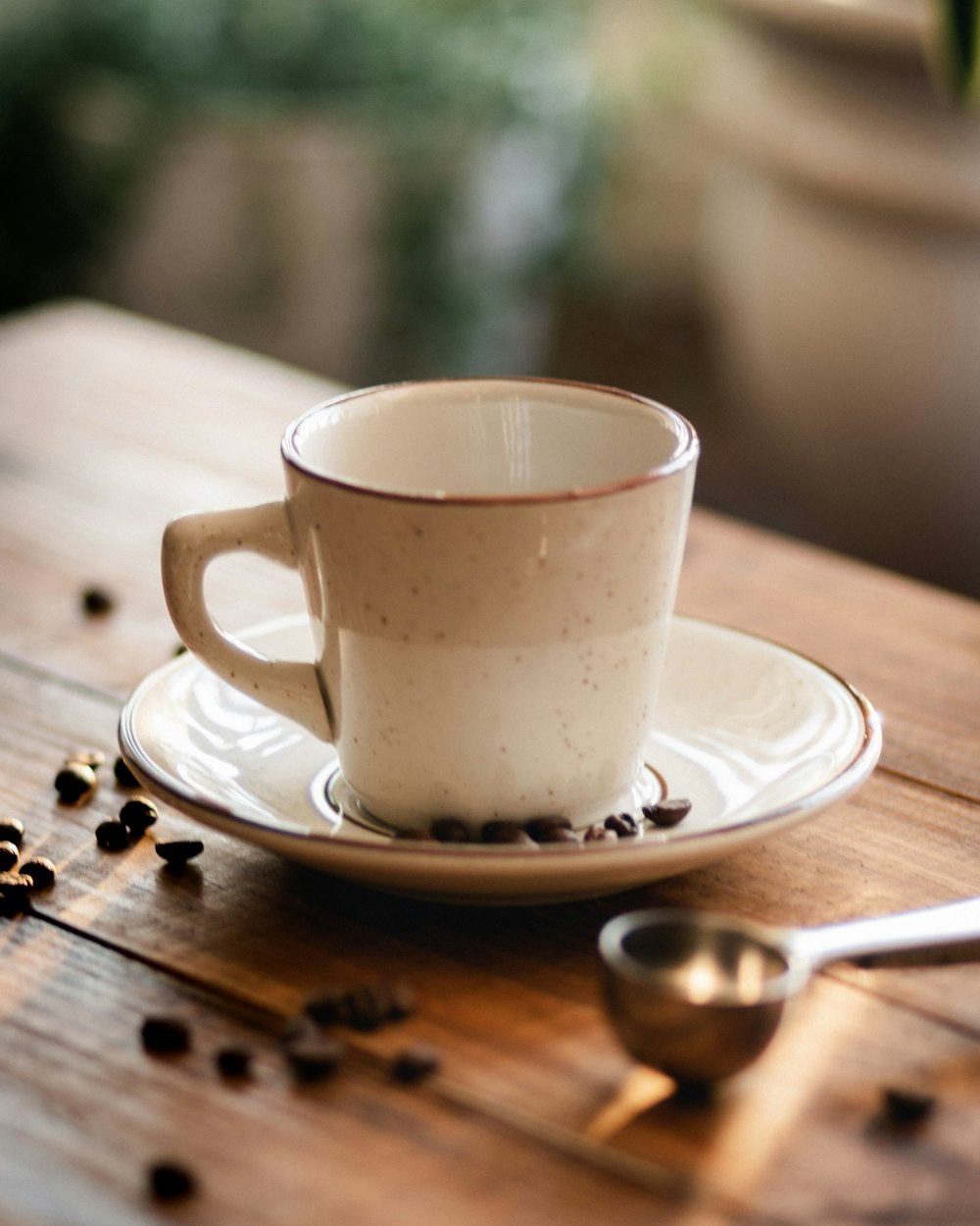 a coffee cup sitting on top of a wooden table