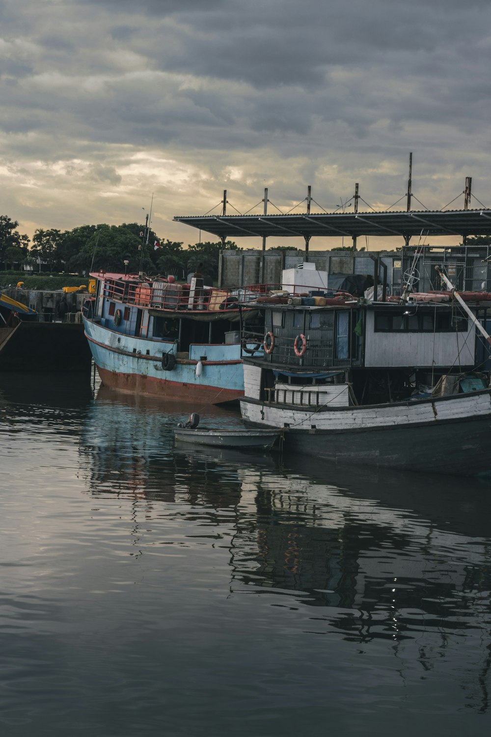 a couple of boats that are sitting in the water