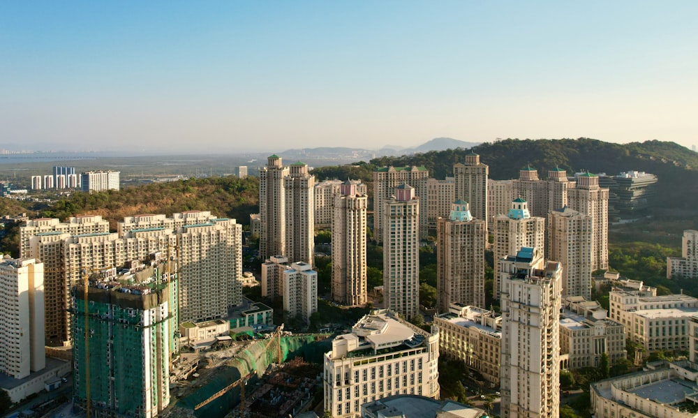 an aerial view of a city with tall buildings