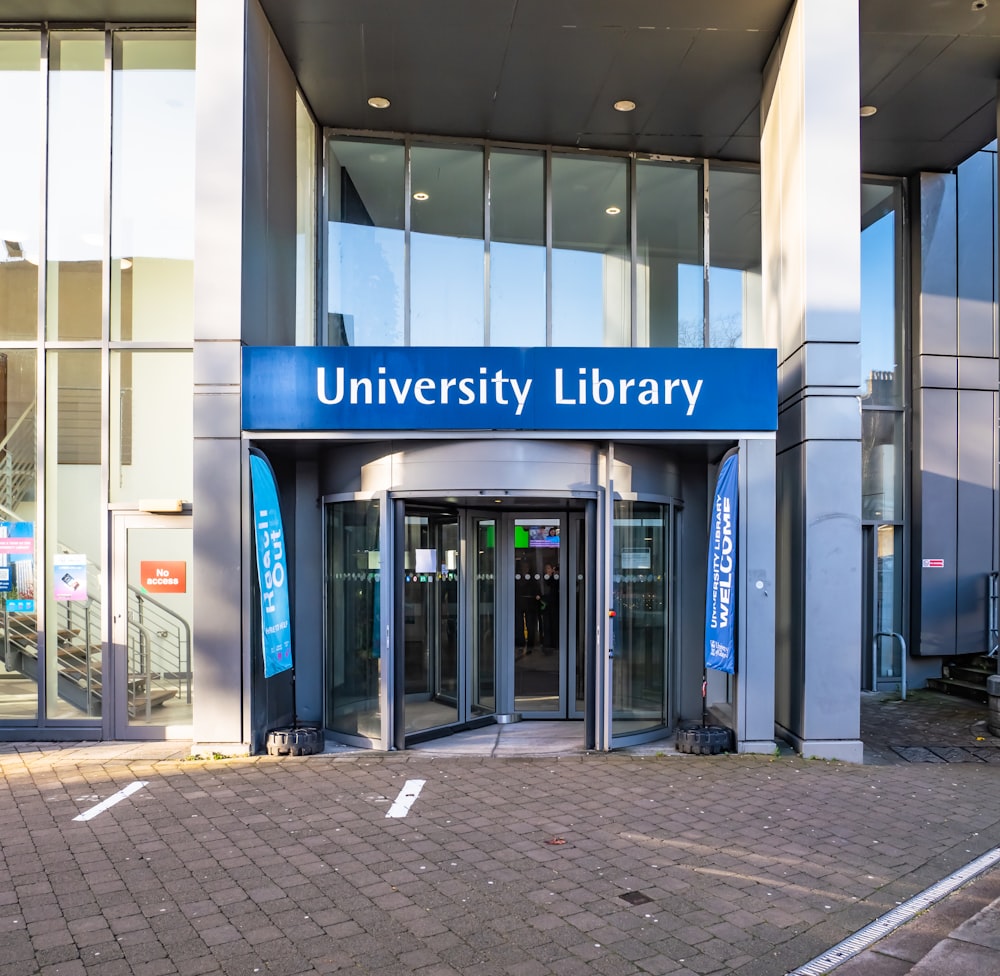 a building with a sign that reads university library