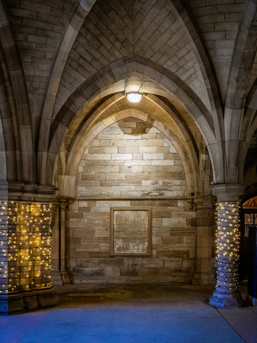 a large stone building with a clock on the wall