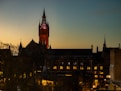a very tall clock tower towering over a city