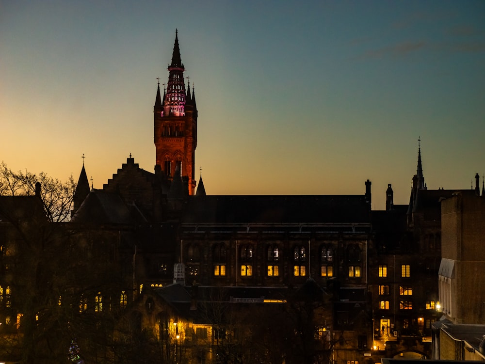 a very tall clock tower towering over a city