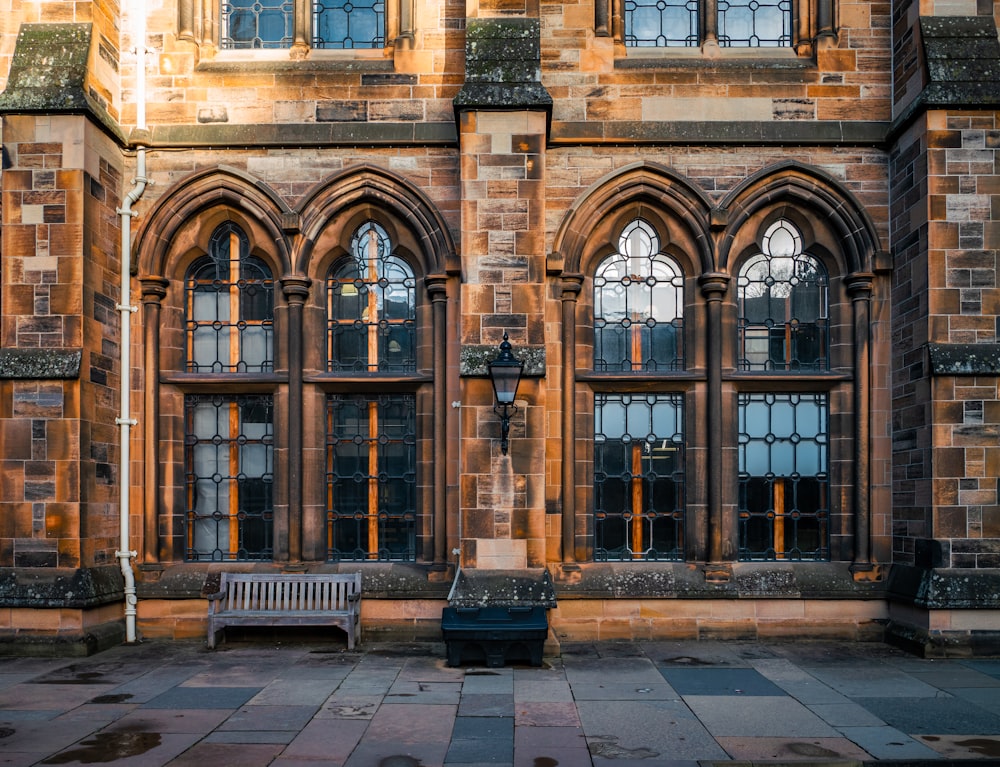 an old building with a bench in front of it