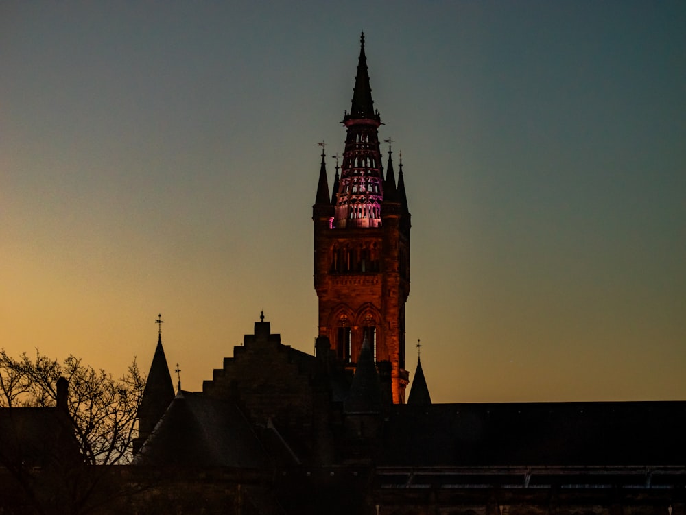 a large clock tower towering over a city