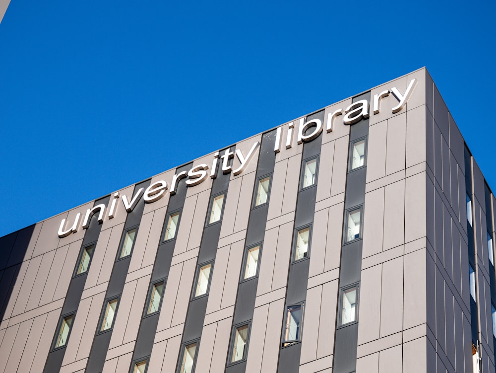 the university library sign on top of a building
