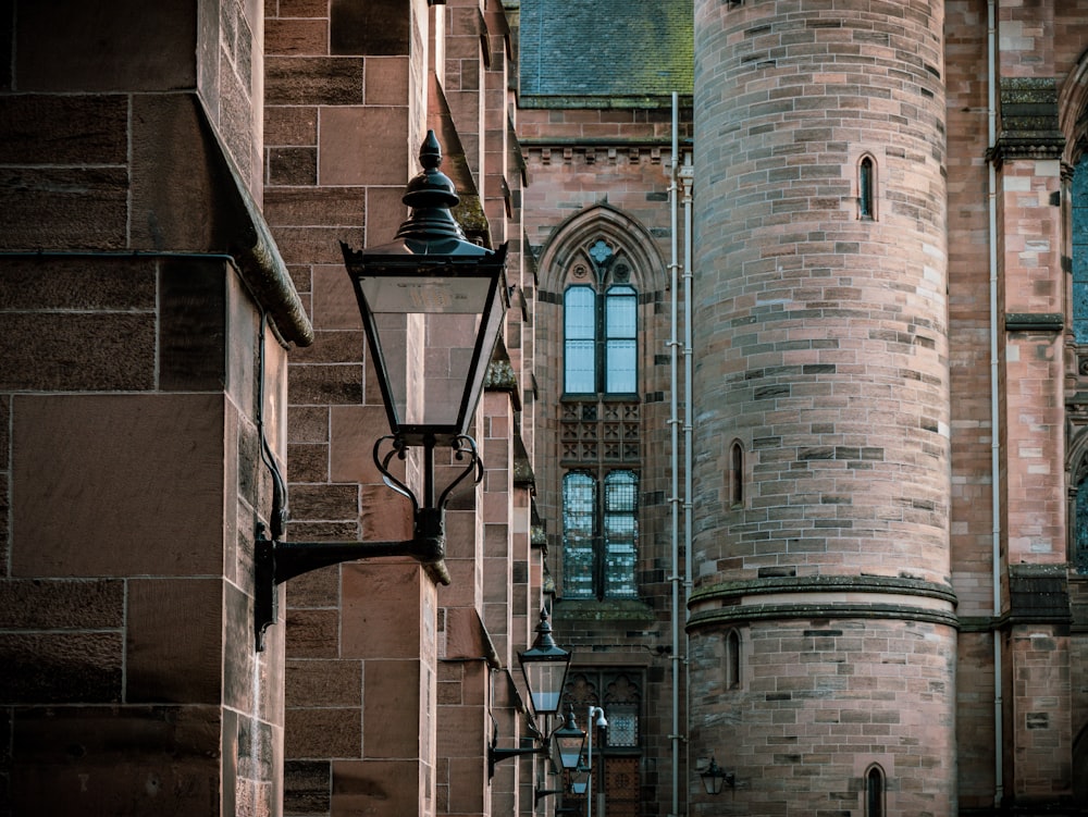 a street light in front of a brick building