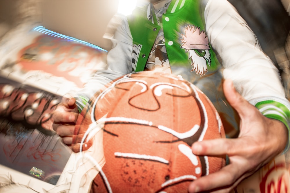 a man holding a basketball in his hands