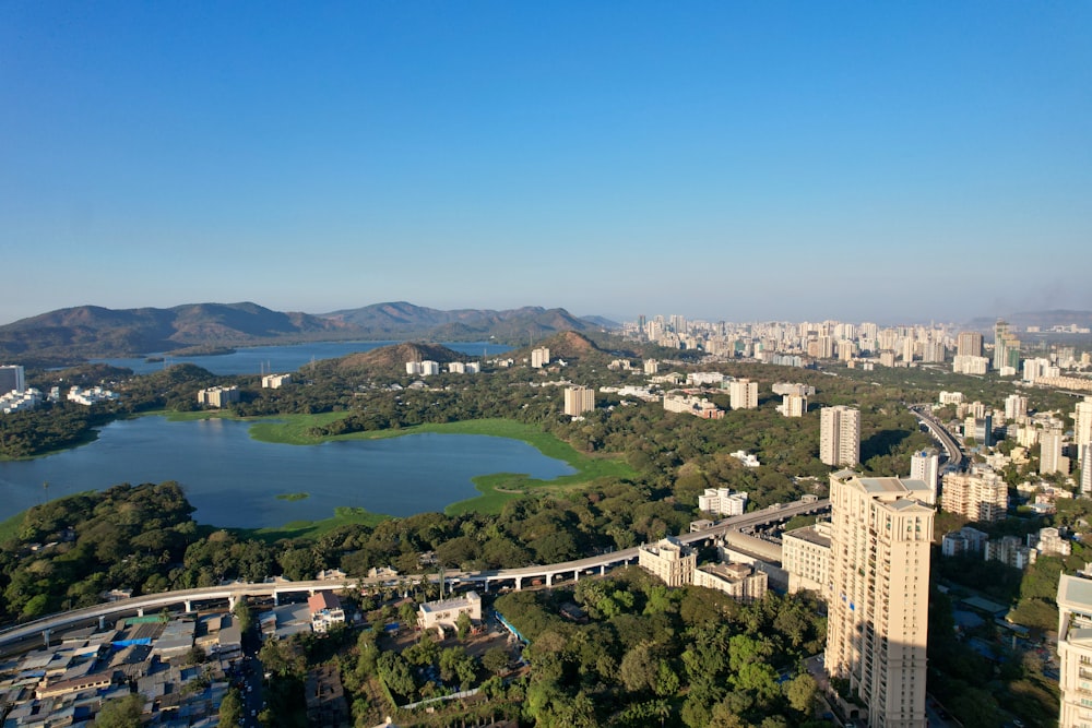 an aerial view of a city and a lake