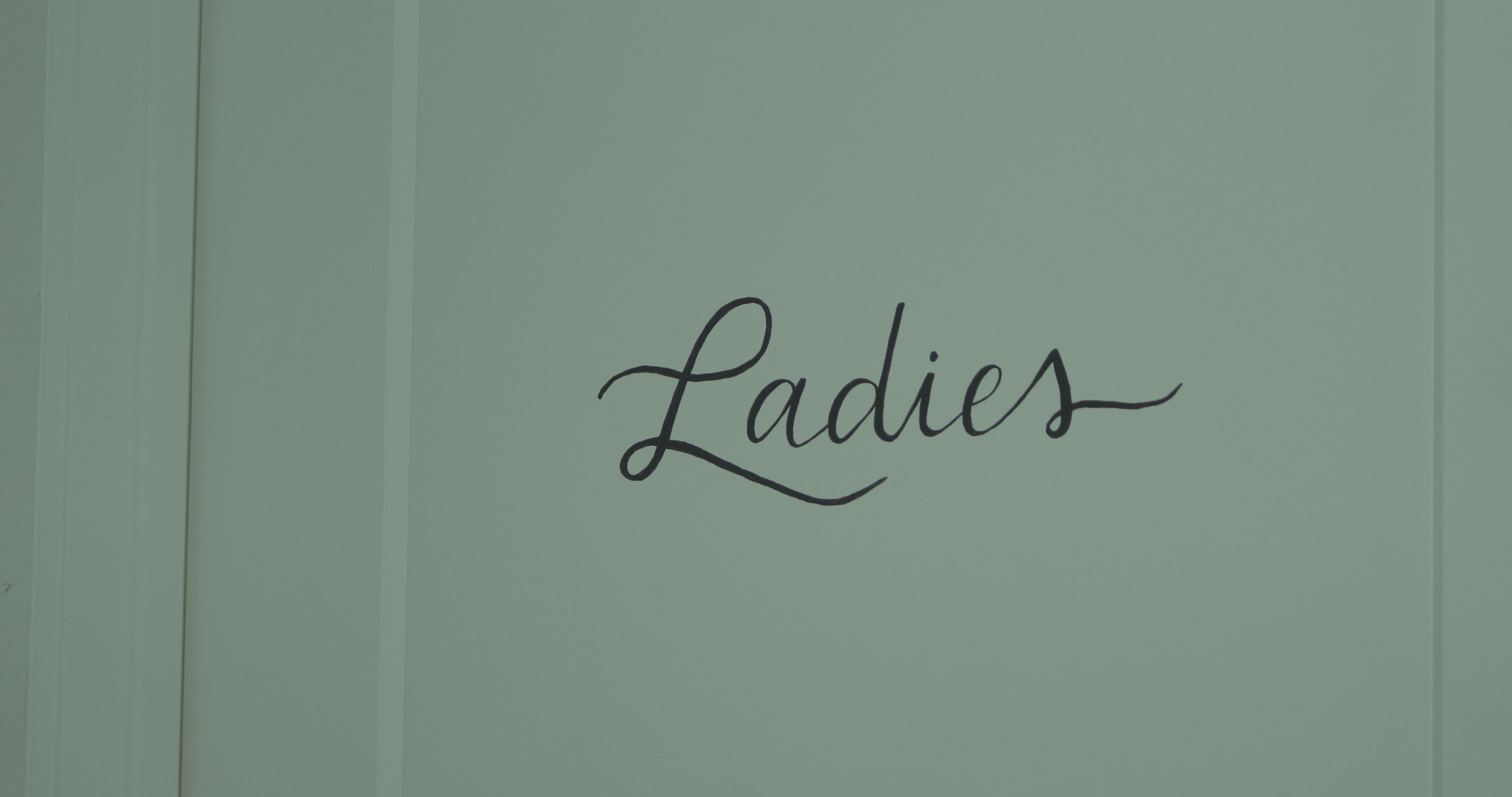 a close up of a wall with writing on it