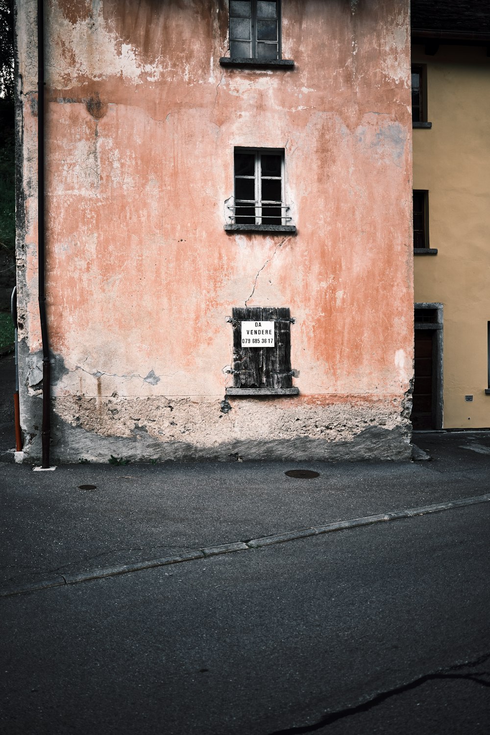 an old building with a sign on the side of it