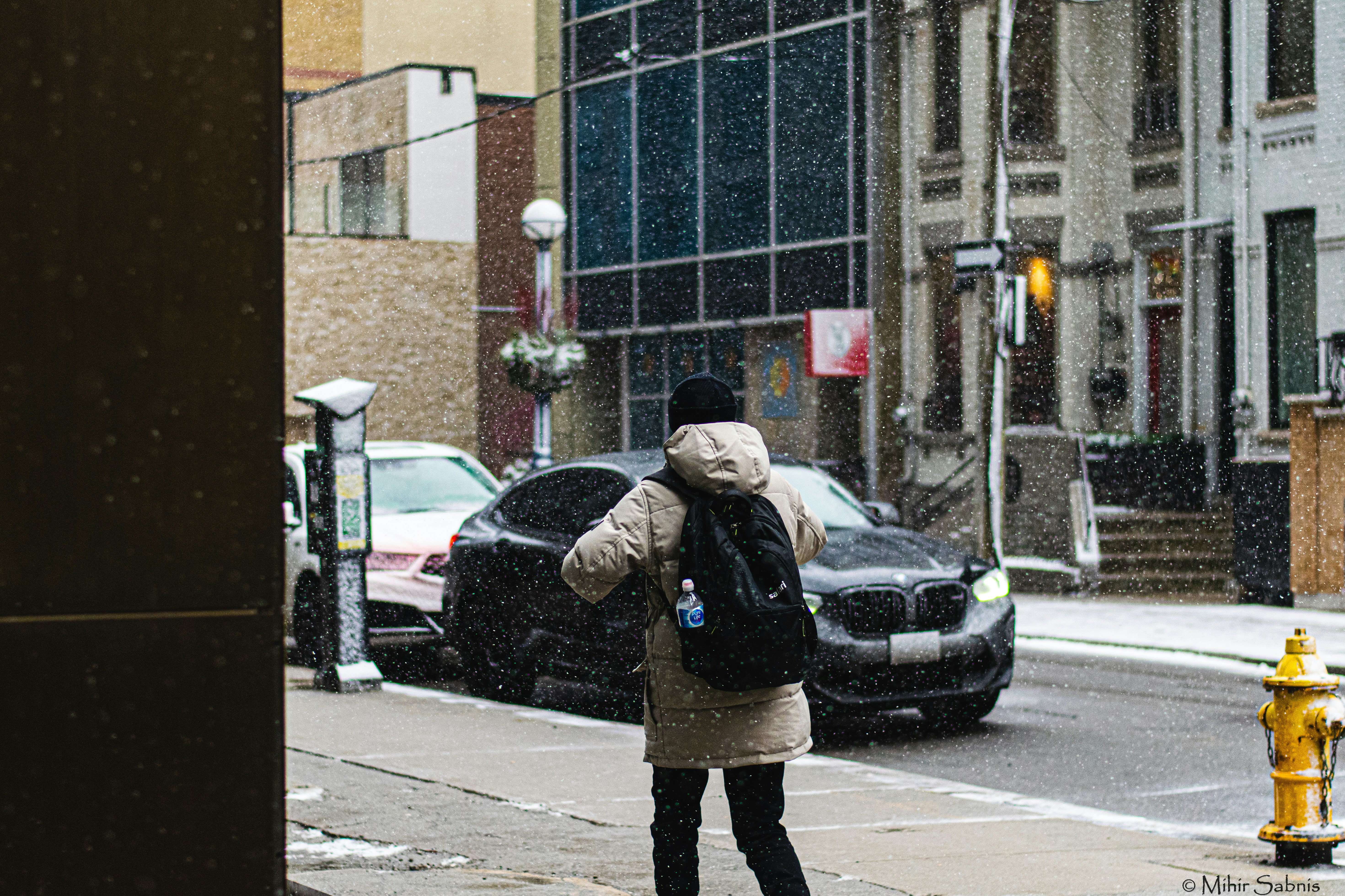 A student leaves college on a snowy day