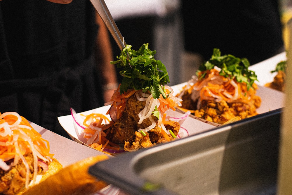 a person cutting food on a plate with a knife