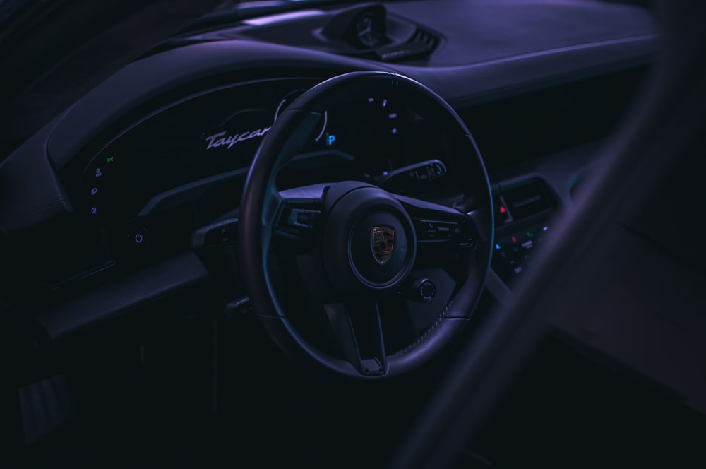 a steering wheel and dashboard of a car