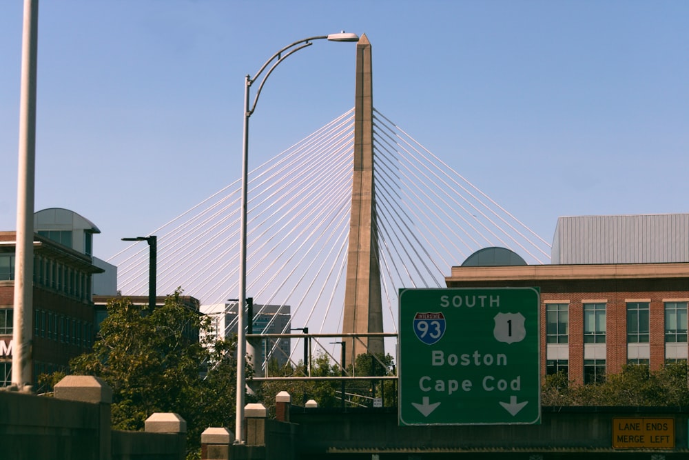 a street sign on the side of a bridge