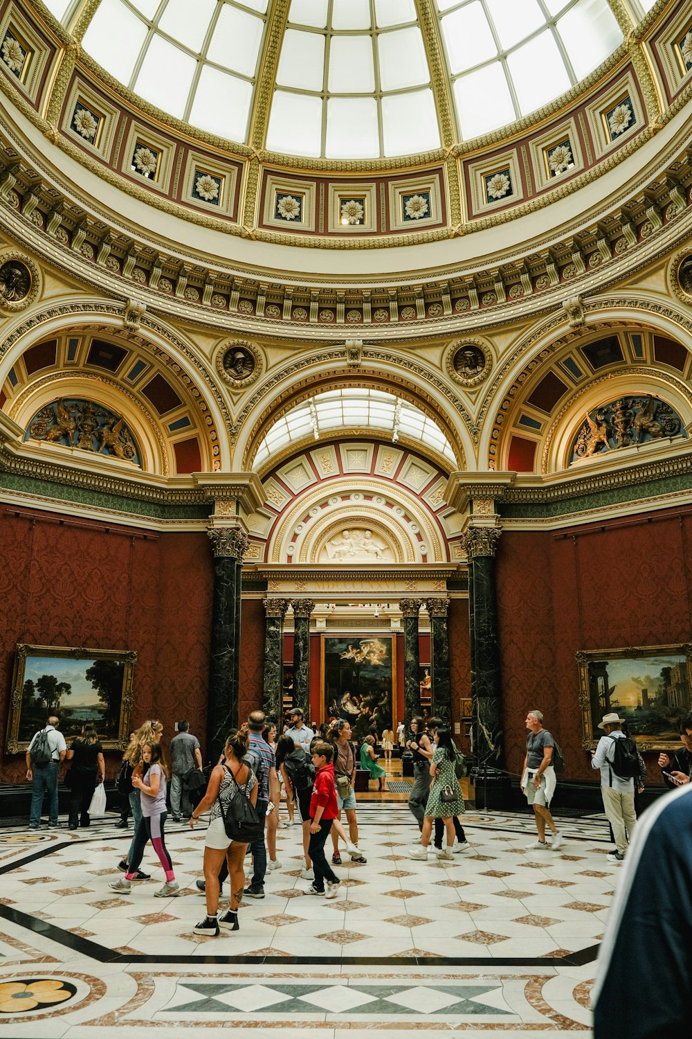 a group of people walking around a building