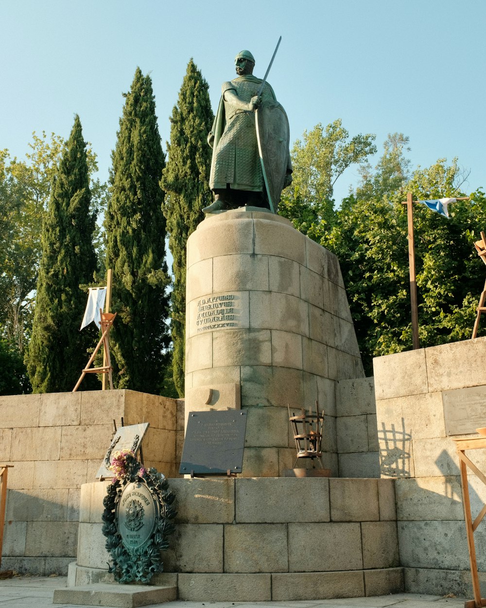 a statue of a man holding a sword