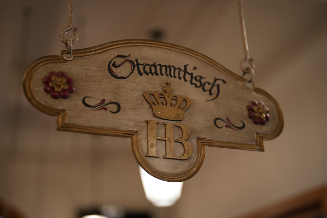 a sign hanging from the ceiling of a building,