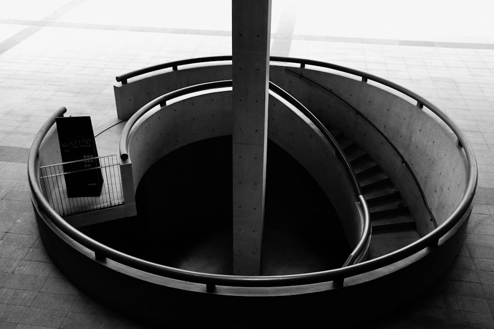 a black and white photo of a spiral staircase