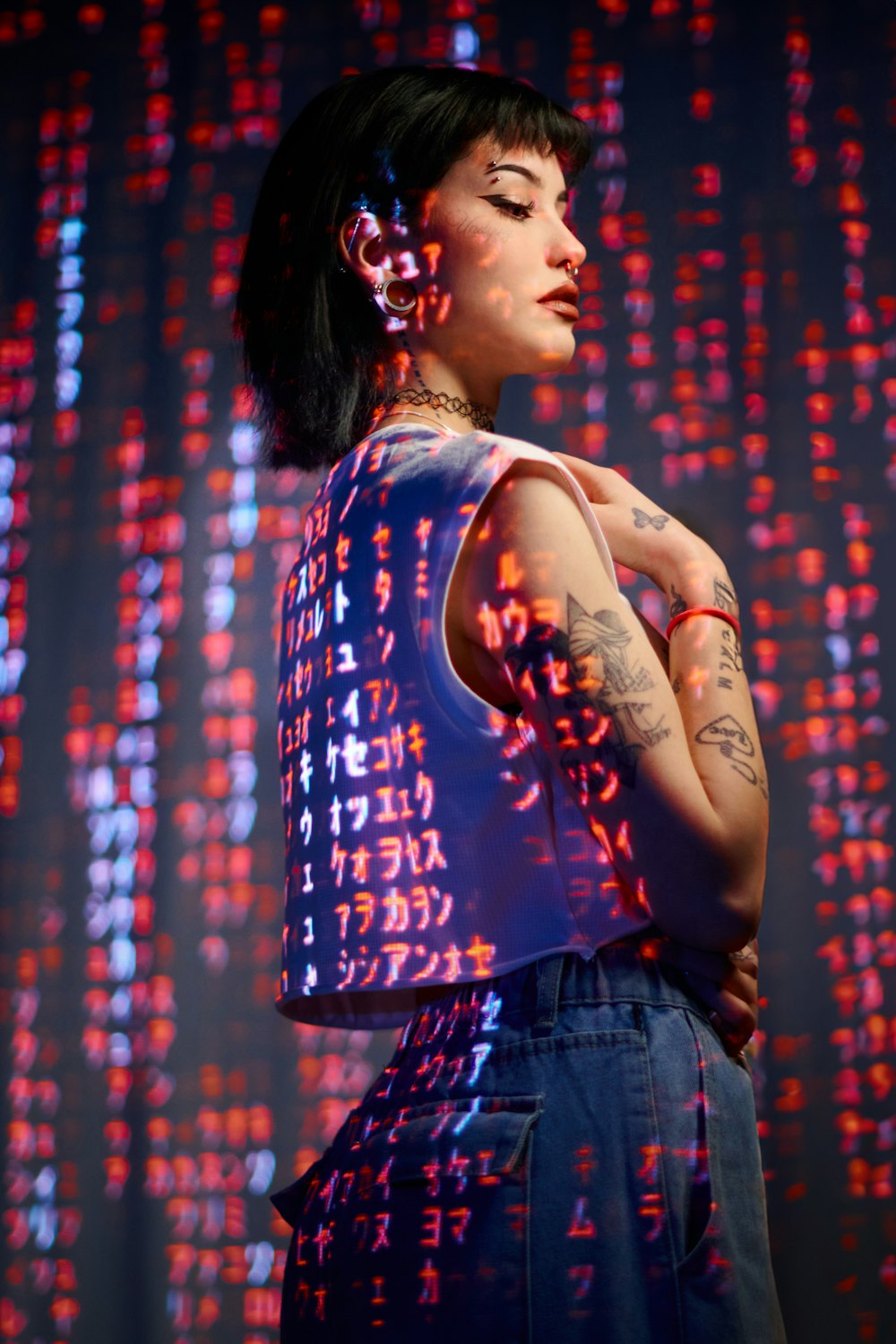 a woman standing in front of a colorful background