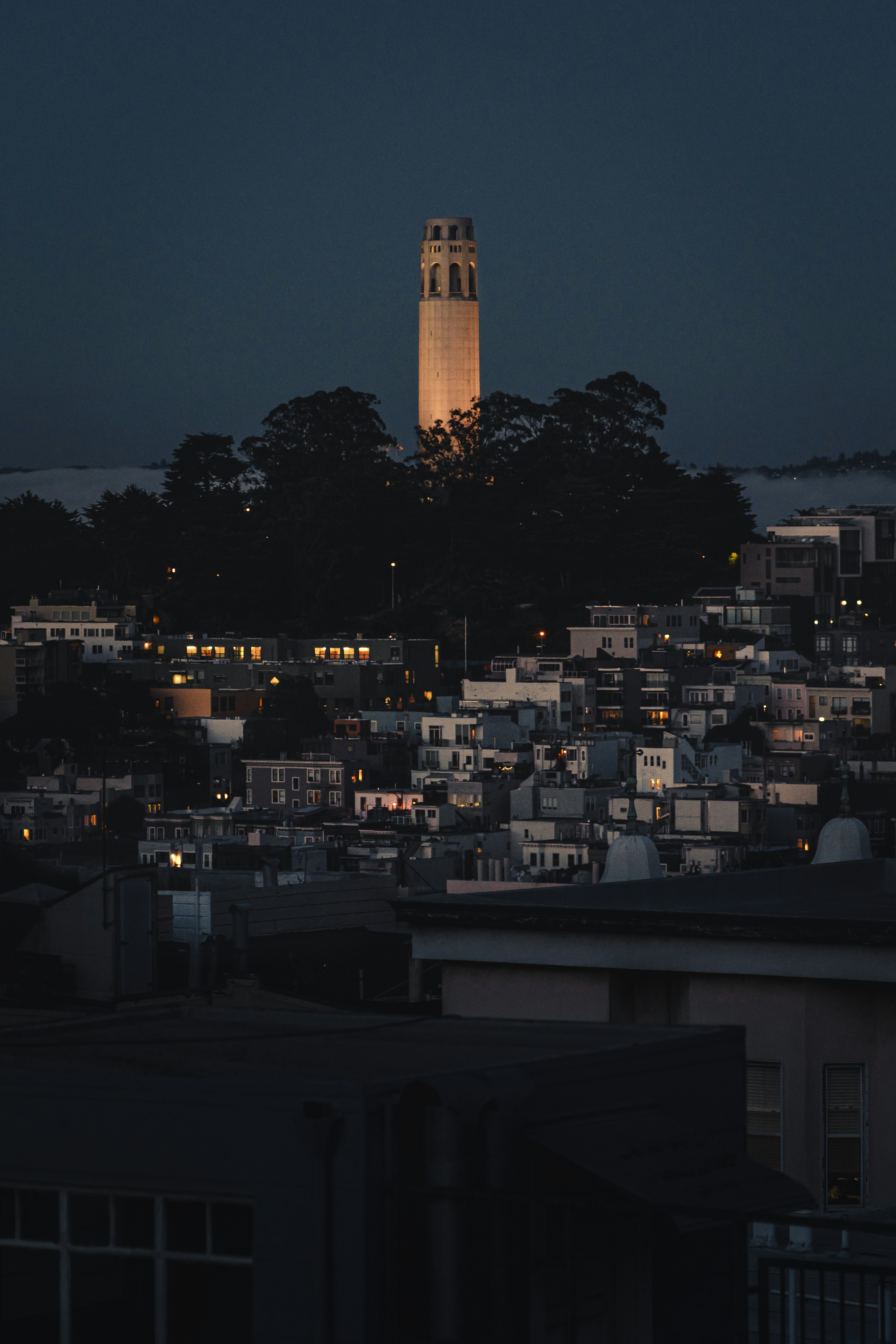 A very tall clock tower towering over a city photo – Free City Image on ...