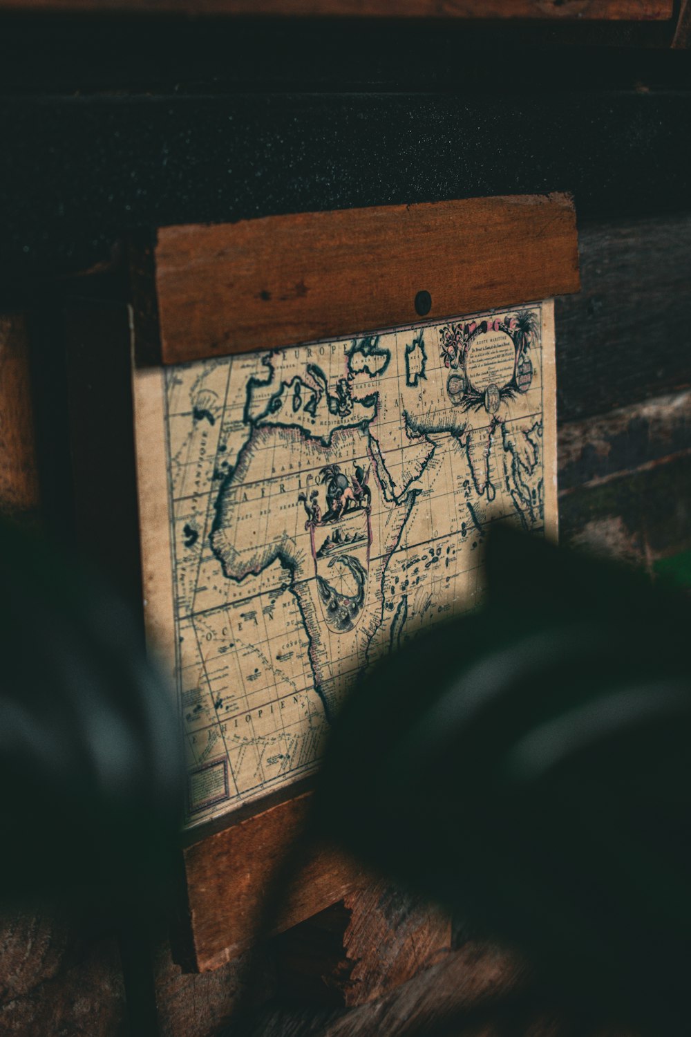 a wooden frame with a map on it