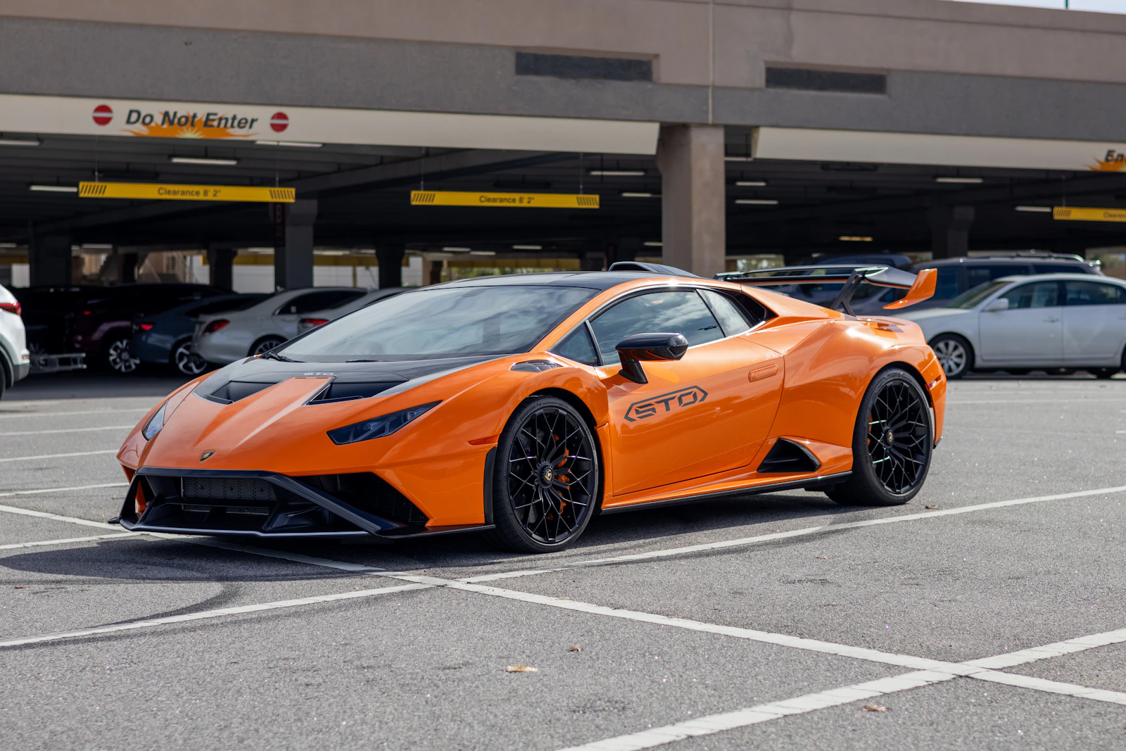 Orange Lamborghini Huracan STO in a parking garage