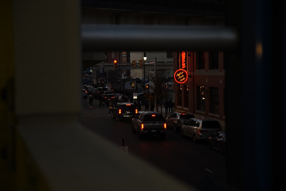 a city street filled with lots of traffic at night