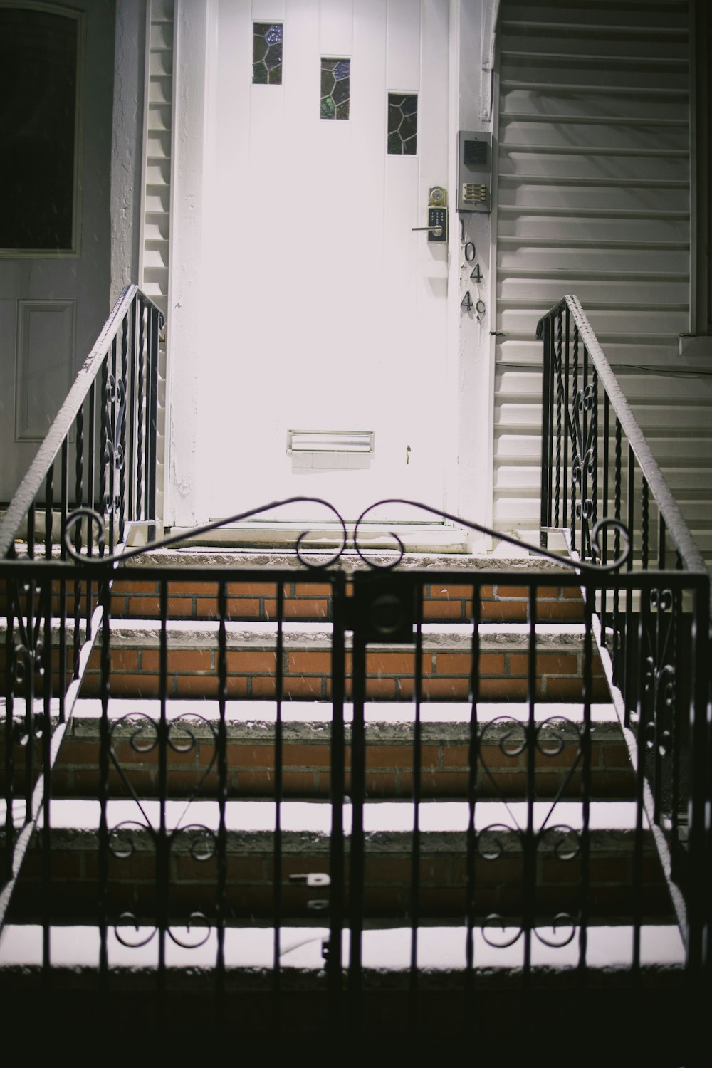 a set of stairs leading to a white door