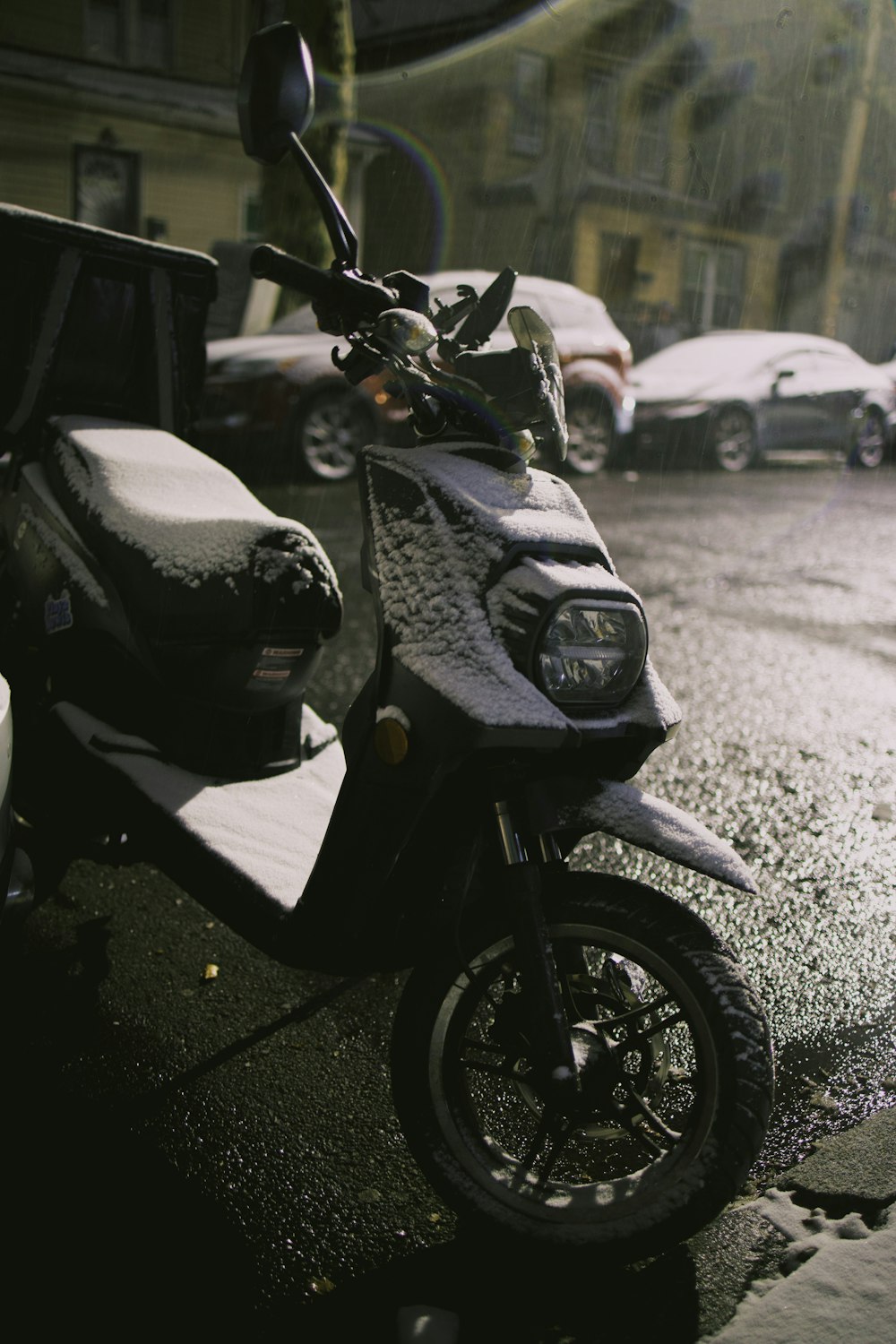 a motor scooter parked on the side of the road