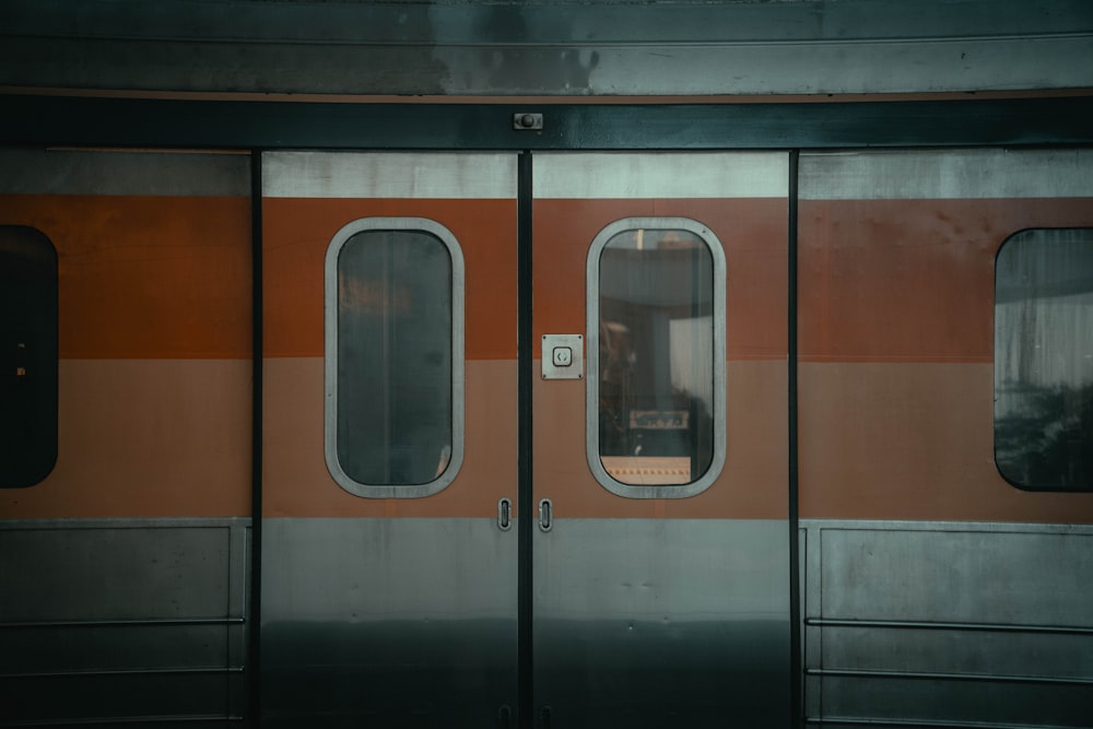 the doors of a train are open to let people in