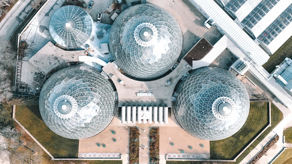 a group of domes sitting on top of a lush green field