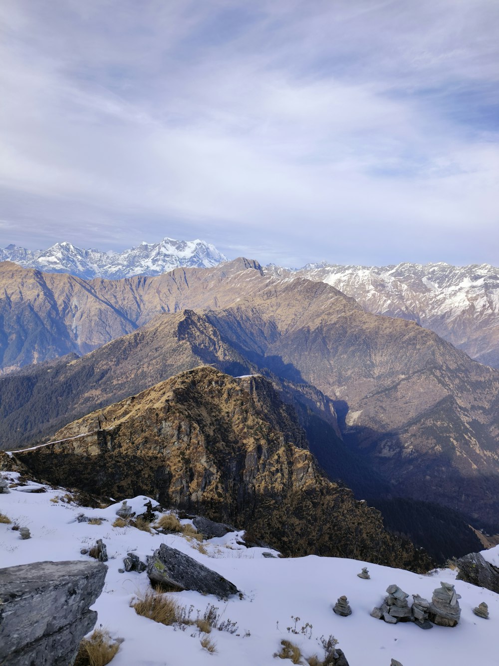 a view of a mountain range covered in snow