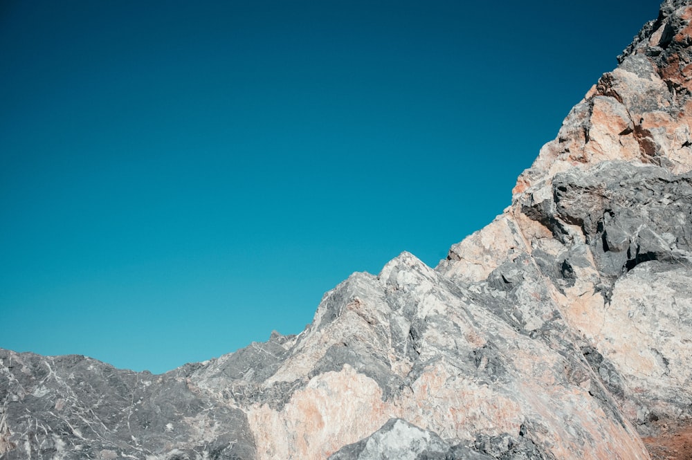 a person standing on top of a rocky mountain