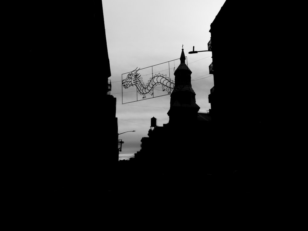 a black and white photo of a clock tower